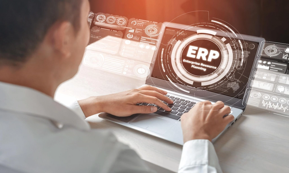person working on laptop having erp icon