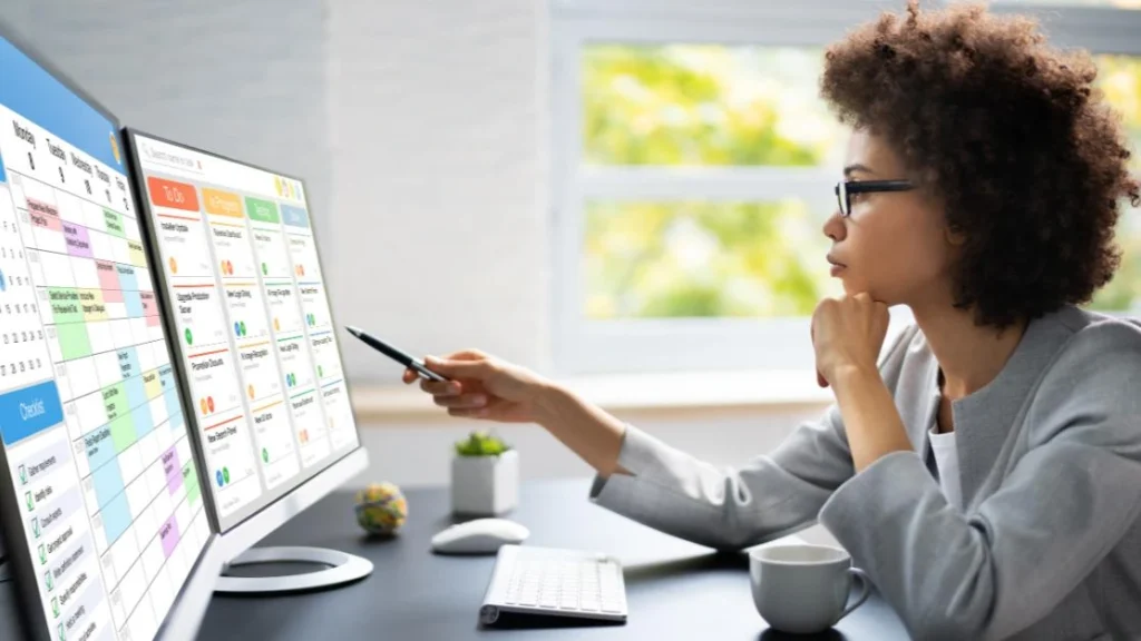 Sales representative using digital productivity tools to manage tasks, schedule meetings, and track sales activities on a business dashboard.